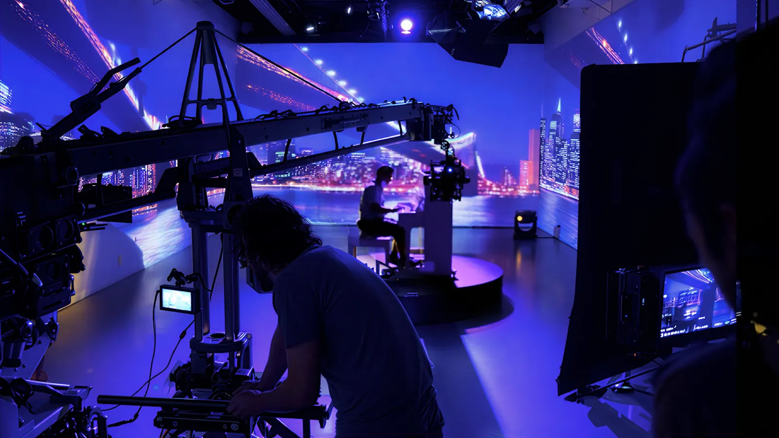 Crane camera on set in front of a projected city skyline
